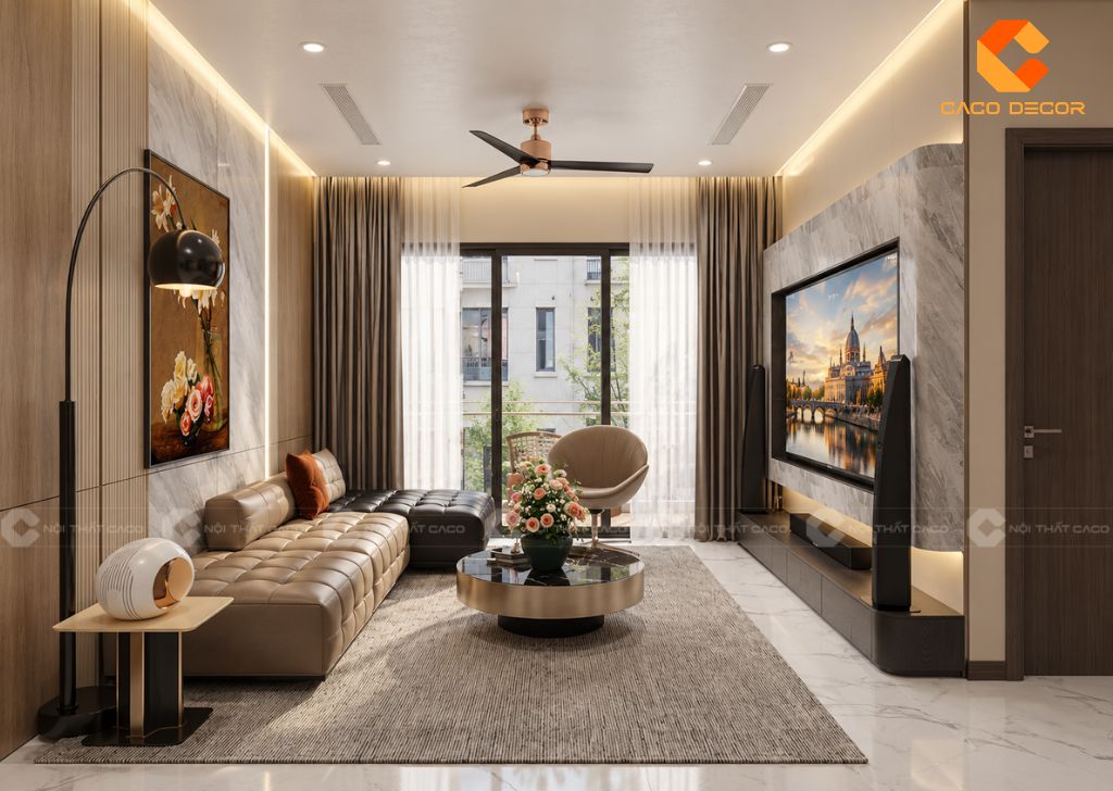 Bộ sofa chữ L bọc nệm màu kem kết hợp bàn trà tròn viền vàng đồng và thảm trải sàn