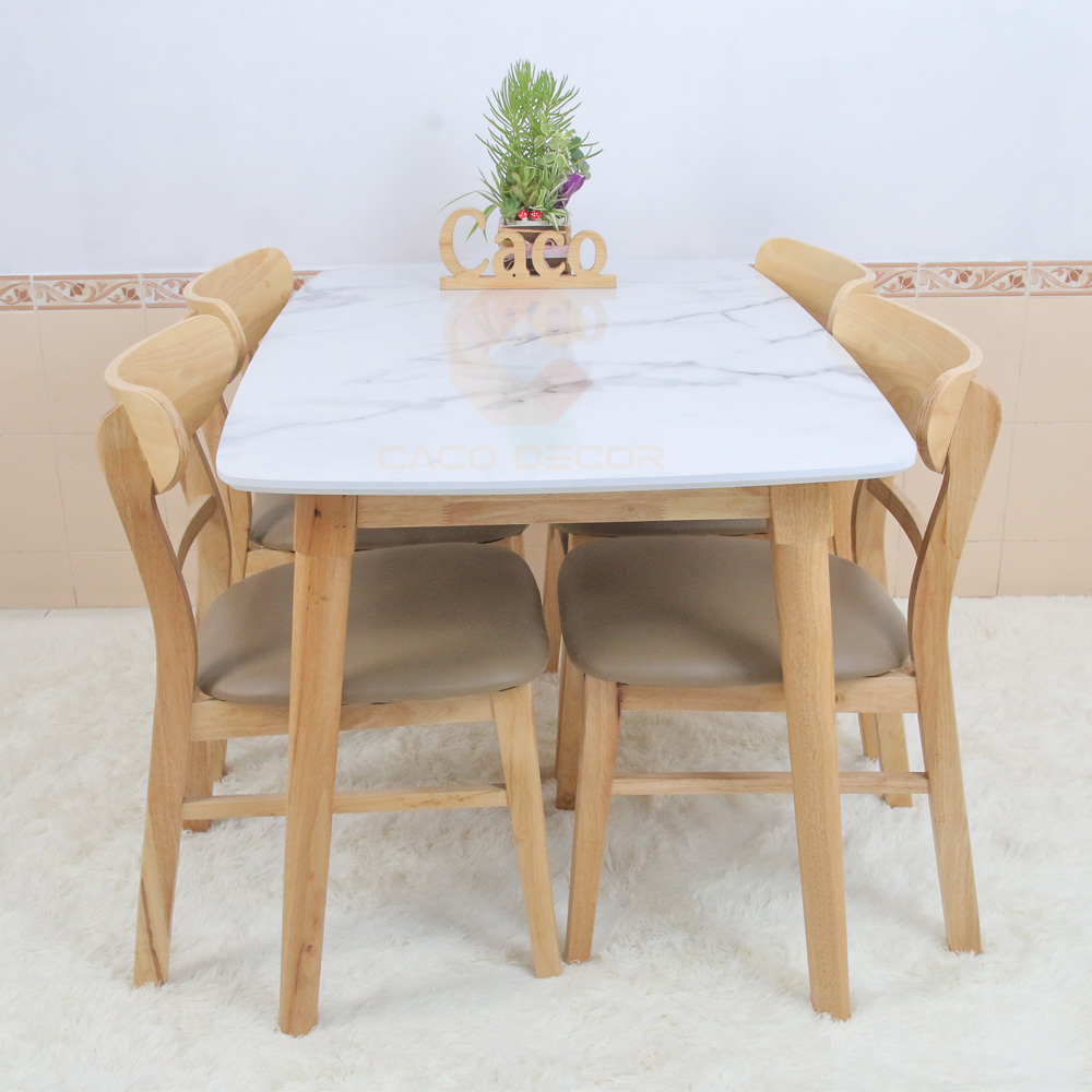 Bộ bàn ăn 4 ghế mặt trăng bọc nệm mặt bàn vân đá trắng là đồ nội thất hiện nay được yêu thích và có số lượng người mua nhiều
